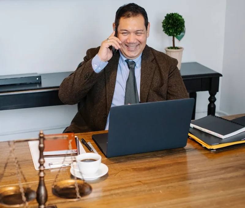 Lawyer talking on the phone in a professional office